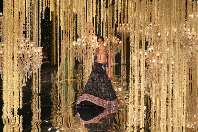 A model presents a creation by designer Suneet Varma during the FDCI India Couture Week in New Delhi on July 26, 2023. (Photo by Money Sharma/AFP Photo)