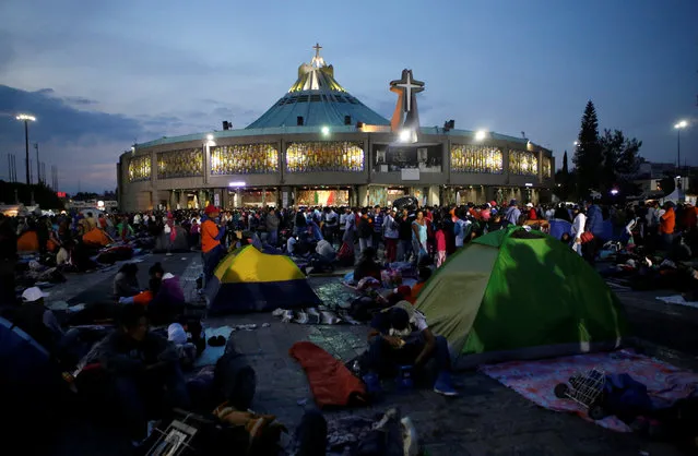 Pilgrims are seen at an improvised camp site at the Basilica of Guadalupe during the annual pilgrimage in honor of the Virgin of Guadalupe, patron saint of Mexican Catholics, in Mexico City, Mexico December 11, 2016. (Photo by Henry Romero/Reuters)
