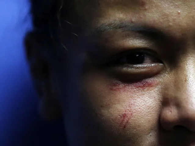 Malaysia's Ann Osman poses for a photograph after her mixed martial arts (MMA) ONE Championship fight against Egypt's Walaa Abbas in Kuala Lumpur, March 13, 2015. (Photo by Olivia Harris/Reuters)