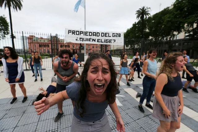 Demonstrators perform outside the presidential palace, ahead of the Group 20 summit, in Buenos Aires, Argentina on November 30, 2018. (Photo by Sergio Moraes/Reuters)
