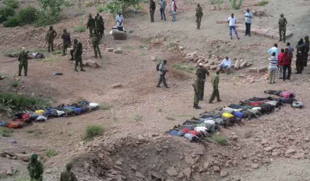 Al Shabaab, which seeks to impose its own harsh version of sharia law, has separated Muslims from Christians in some of its previous raids in Kenya, notably late last year in attacks on a bus and at a quarry. Here: people stand near bodies lined up on the ground at a quarry site where attackers killed at least 36 workers in a village in Korome, outside the border town of Mandera December 2, 2014. (Photo by Reuters/Stringer)