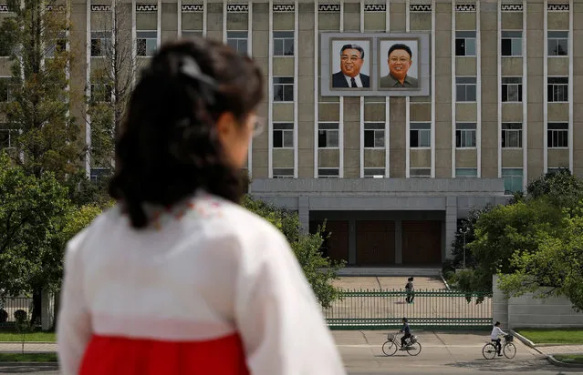 Portraits of late North Korean leaders Kim Il Sung and Kim Jong Il are seen on the facade of a government building in Pyongyang, North Korea, September 11, 2018. (Photo by Danish Siddiqui/Reuters)