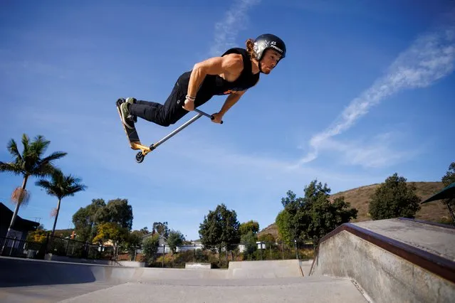 Professional scooter rider Vincent Kudrna trains at a skatepark in San Diego, California on December 4, 2023. (Photo by Mike Blake/Reuters)