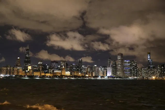 The Chicago skyline is partially powered down for Earth Hour on Saturday, March 30, 2019. Earth Hour, spearheaded by the World Wildlife Fund, calls for greater awareness and more sparing use of resources, especially fossil fuels that produce carbon gases and lead to global warming. (Photo by Chris Sweda/Chicago Tribune via AP Photo)