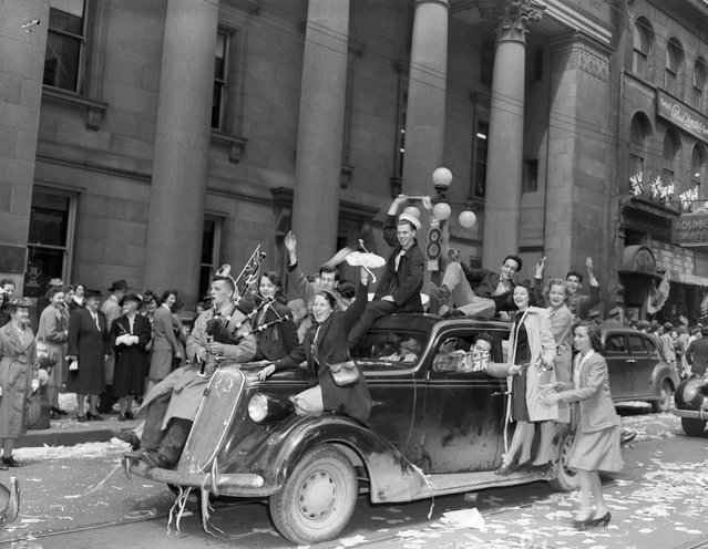 Military personnel and civilians celebrate VE-Day on Sparks Street in Ottawa, Ontario, May 8, 1945, in this handout photo provided by Canada Department of National Defence. (Photo by Reuters/Canada Department of National Defence/Library and Archives Canada)