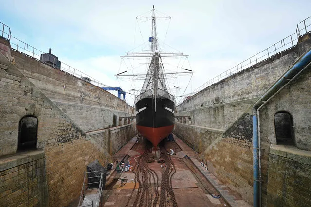 A picture taken on January 25, 2016 in La Rochelle, western France, shows the French frigate Belem, a training vessel, in a dry dock at the Grand Maritime port of La Rochelle as it receives it' s winter maintenance. The Belem, a three- masted historic frigate built in 1896 and that has just celebrated its 121 th birthday, has been in the dry dock for more than a month and will sail on February 14, 2017 for Bordeaux before embarking on its cruise through Europe. (Photo by  Xavier Leoty/AFP Photo)