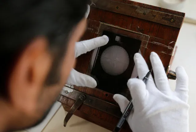 A technician works inside the archival digitisation lab at the Kodaikanal Solar Observatory, India, February 3, 2017. (Photo by Danish Siddiqui/Reuters)