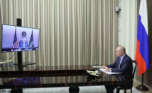 Russian President Vladimir Putin is shown during his talks with U.S. President Joe Biden via videoconference in the Bocharov Ruchei residence in the Black Sea resort of Sochi, Russia, Tuesday, December 7, 2021. Biden “told President Putin directly that if Russia further invades Ukraine, the United States and our European allies would respond with strong economic measures”, U.S. National Security Adviser Jake Sullivan said after the call. (Photo by Mikhail Metzel, Sputnik, Kremlin Pool Photo via AP Photo)
