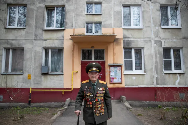 World War Two veteran Nikolay Bagayev, 100, poses for a picture dressed in his uniform, in front of his apartment block in Korolyov, north of Moscow, Russia on April 18, 2019. (Photo by Maxim Shemetov/Reuters)