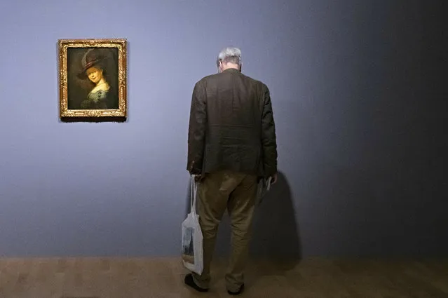 A visitor stands besides the painting “Bust of a young woman smiling (Saskia van Uylenburgh)” (1633) by Rembrandt during a press preview of the exhibition “Rembrandt's Mark” in Dresden, eastern Germany, Thursday, June 13, 2019. The exhibition presents about 100 works from Rembrandt's entire career in dialogue with about 50 etchings and drawings of selected contemporaries and later artists who perceived him as an authority and a source of inspiration. 2019 marks 350 years since Rembrandt van Rijn's (1606-1669) death. The exhibition starts on June 14, 2019 and last until September 9, 2019. (Photo by Jens Meyer/AP Photo)
