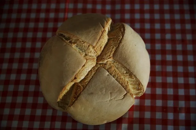 A traditional pan de cruz (bread with a cross) is pictured in Puerto Lapice, Spain, April 8, 2016. (Photo by Susana Vera/Reuters)