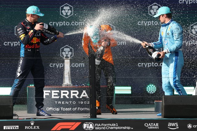 First place McLaren driver Lando Norris of Britain (C) gets sprayed by champagne from second place Red Bull Racing driver Max Verstappen of Netherlands (L) and Scuderia Ferrari driver Charles Leclerc of Monaco (R) on the winners podium in the Formula 1 Miami Grand Prix, at the Miami International Autodrome in Miami Gardens, Florida, USA, 05 May 2024. (Photo by Cristóbal Herrera/EPA/EFE)