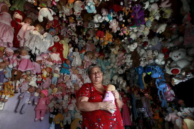 Andrea Rojas, 70, poses with her collection of dolls at her home in Heredia, Costa Rica, August 5, 2015. Rojas has been collecting dolls for over twenty years and has more than 4,500 dolls. (Photo by Juan Carlos Ulate/Reuters)