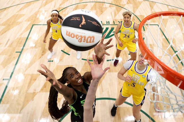 Ezi Magbegor #13 of the Seattle Storm rebounds against the Los Angeles Sparks at Climate Pledge Arena on June 11, 2024 in Seattle, Washington. (Photo by Steph Chambers/Getty Images/AFP Photo)