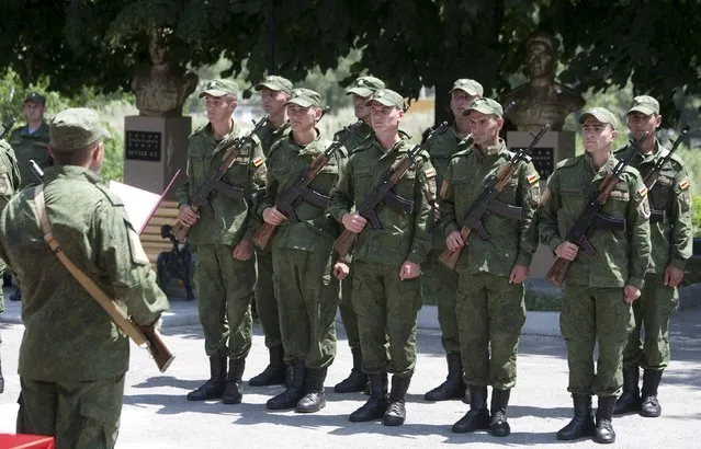 Servicemen of the military forces of South Ossetia attend an oath of allegiance ceremony in Tskhinvali, the capital of the breakaway region of South Ossetia, Georgia, July 5, 2015. (Photo by Kazbek Basaev/Reuters)