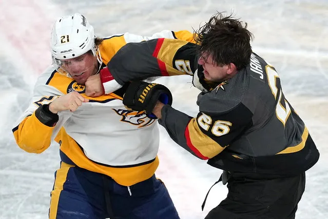 Vegas Golden Knights center Mattias Janmark (26) punches Nashville Predators center Nick Cousins (21) in a fight during the third period at T-Mobile Arena in Las Vegas, Nevada on March 24, 2022. (Photo by Stephen R. Sylvanie/USA TODAY Sports)