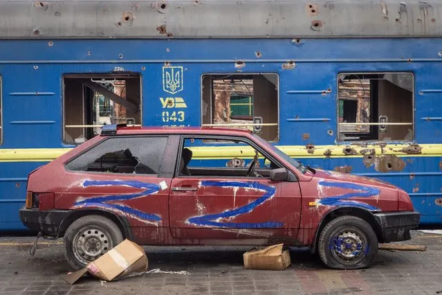 An car marked witha “Z” is seen destroyed at the central train station that was used as a Russian base on March 30, 2022 in Trostyanets, Ukraine. Ukrainian forces announced this week that they had retaken Trostyanets, a northeastern town  that has seen fierce fighting and was occupied by Russians for weeks, from Russian control. Last week, after its advances have stalled on several fronts, Russia appeared to revise its military goals in Ukraine, claiming that it would focus its efforts on the battle in the eastern Donbas region. (Photo by Chris McGrath/Getty Images)