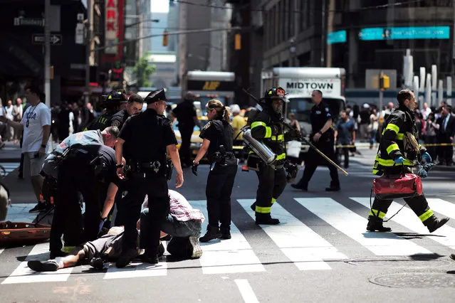 First responders arrive at the scene after a car plunged into pedestrians in Times Square in New York on May 18, 2017. (Photo by Jewel Samad/AFP Photo)