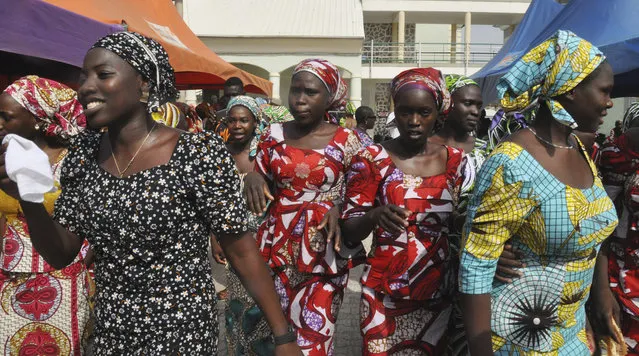 Recently freed schoolgirls prior to being reunited with their parents, in Abuja, Nigeria, Saturday, May 20, 2017. ﻿The 82 Nigerian schoolgirls recently released after more than three years in Boko Haram captivity reunited with their families for the first time Saturday, as anxious parents looked for signs of how deeply the extremists had changed their daughters' lives. (Photo by Olamikan Gbemiga/AP Photo)