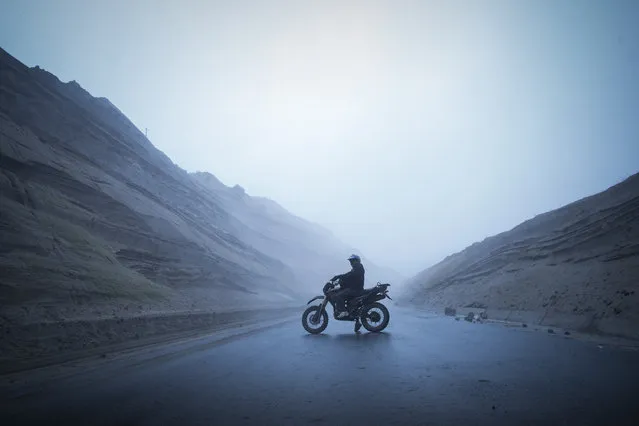 “Savior in the fog”. Last february, I walked a 12 km track to Chugchilan village, surrounded by unexpected dense clouds of fog. After four hours of breathtaking landscapes I finally arrived to my destiny. Asking for a bus to get back, a local explained me that there was no bus coming by that day anymore. Disappointed and exhausted I started walking along the quiet and foggy highway. (Photo and caption by Alessandro Bo/National Geographic Photo Contest)