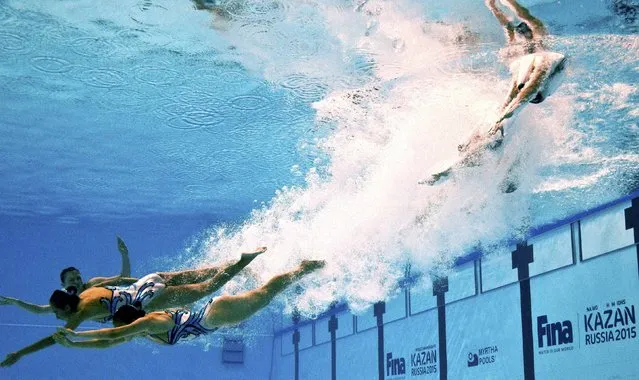 Members of Team Hongkong are seen underwater as they perform in the synchronised swimming team free routine preliminary at the Aquatics World Championships in Kazan, Russia July 28, 2015. (Photo by Michael Dalder/Reuters)