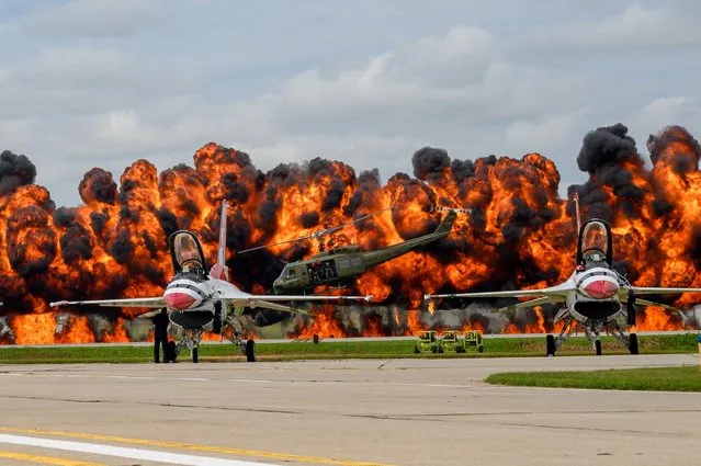 The Air Force Thunderbirds sit on the tarmac as explosions go off during the 2019 Sioux Falls Airshow in Sioux Falls, South Dakota on August 18, 2019. (Photo by Duane Duimstra/Courtesy U.S. Air National Guard via Reuters)