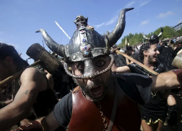 A man dressed up as a Viking shouts during the annual Viking festival of Catoira in north-western Spain August 2, 2015. (Photo by Miguel Vidal/Reuters)