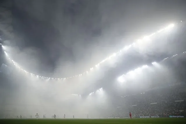 Smoke from flares fills the Orange Velodrome, in southern French city Marseille on May 5, 2022, during the Europa Conference League semi final second leg between Olympique de Marseille and Feyenoord. The Dutch side won 3-2 on aggregate, after the game ended goalless. (Photo by Stephane Mahe/Reuters)