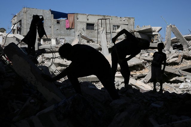 Palestinians remove the rubble of houses destroyed by Israeli strikes in Khan Younis in the southern Gaza Strip on September 4, 2024. (Photo by Hatem Khaled/Reuters)