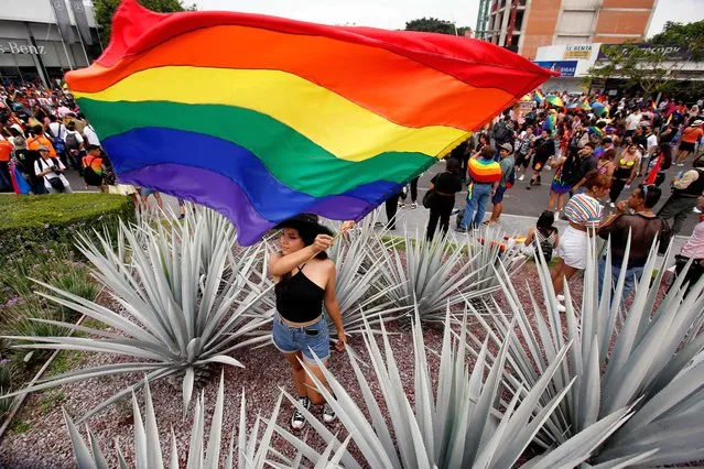 People take part in a LGBT+ Pride march through the main streets in Guadalajara, Jalisco State, Mexico, June 4, 2022. (Photo by Ulises Ruiz/AFP Photo)