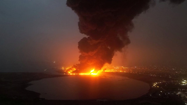 Smoke rises from the site of Israeli air strikes in the port city of Hodeidah, Yemen in this handout photo released July 20, 2024. (Photo by Houthi Military Media/Handout via Reuters)