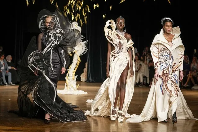 Canadian fashion model Winnie Harlow, from right, and models wear creations as part of Iris van Herpen Haute Couture Fall/Winter 2022-2023 fashion collection presented Monday, July 4, 2022 in Paris. (Photo by Michel Euler/AP Photo)