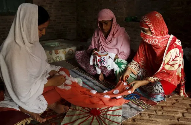 An artisan teaches students crochet and needlepoint techniques under a project initiated by the Tourism Corporation of Khyber Pakhtunkhwa at the Culture Tourist and Artisan Center inside the Gor Khatri Archaeological Complex in Peshawar, Pakistan, August 19, 2015. (Photo by Khuram Parvez/Reuters)