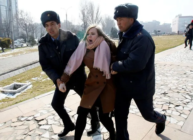 Kyrgyz law enforcement officers detain a women's rights activist during a rally on International Women's Day in Bishkek, Kyrgyzstan on March 8, 2020. (Photo by Vladimir Pirogov/Reuters)