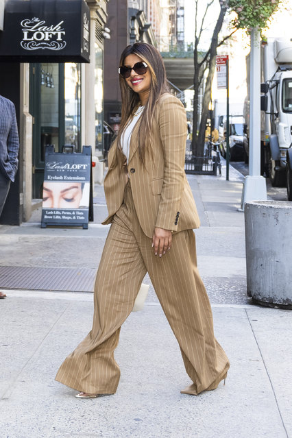Priyanka Chopra is pictured heading to her restaurant, Sona for lunch in New York City on September 21, 2022. The 40 year old Indian actress looked stylish is a tan striped blazer, matching trousers, white blouse, and heels. (Photo by The Image Direct)