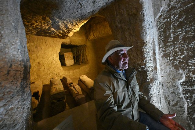 Egyptian archaeologist Zahi Hawass speaks with reporters in front of burial shafts and wooden coffins from the 17th dynasty, during a media event to announce new discoveries by Egyptian archaeological mission he leads at Queen Hatshepsut's Valley Temple in Deir El-Bahari on the Nile's west bank in Luxor on December 8, 2025. (Photo by Khaled Desouki/AFP Photo)