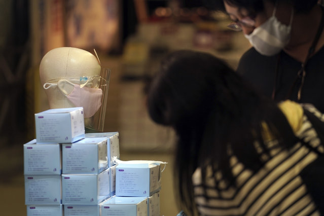 Protective face masks to help curb the spread of the coronavirus are sold at a shop Friday, July 10, 2020, in Tokyo. The Japanese capital has confirmed more than 240 new coronavirus infections on Friday, exceeding its previous record. (Photo by Eugene Hoshiko/AP Photo)