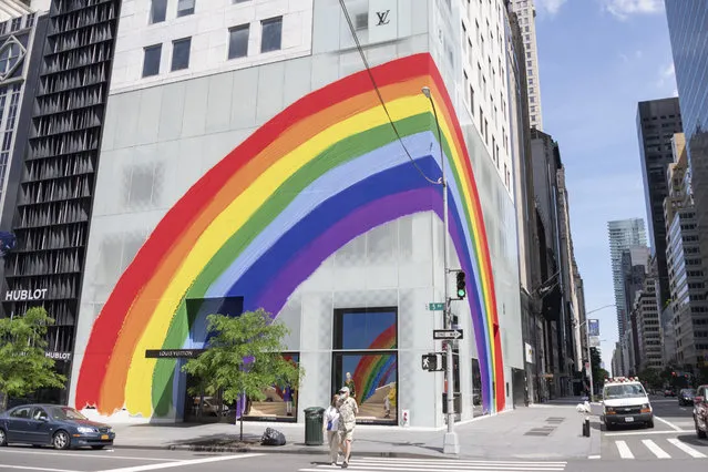 A view of the Louis Vuitton on 5th Avenue displays pride colors on June 21, 2020 in New York City. Due to the ongoing Coronavirus pandemic, this year's pride march had to be canceled over health concerns. The annual event, which sees millions of attendees, marks it's 50th anniversary since the first march following the Stonewall Inn riots. (Photo by Alexi Rosenfeld/Getty Images)