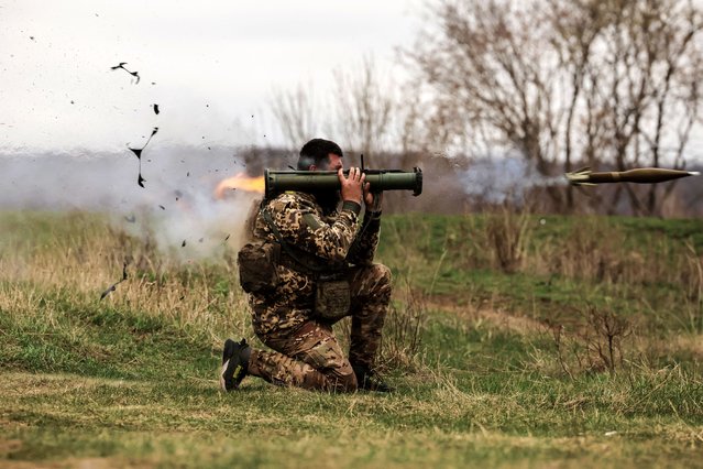 A serviceman of Ukraine's 24th Mechanized Brigade uses a grenade launcher during a training exercise, in an undisclosed location in the east of Ukraine on March 30, 2025. (Photo by Oleg Petrasiuk/Ukrainian Armed Forces)