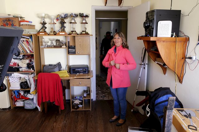 Laura Paipo, first blind principal in Uruguay dresses up to go to work at her home in Montevideo, September 18, 2015. (Photo by Andres Stapff/Reuters)