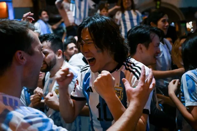 Argentina fans celebrate after Argentina beat France to win the 2022 FIFA World Cup Final in Qatar on December 18, 2022 at the Joyce Public House bar in New York City. Argentina won 4-2 on penalties following a 3-3 draw after extra time. (Photo by Alexi Rosenfeld/Getty Images)