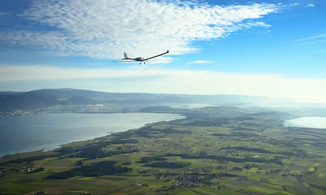 SolarStratos solar powered aircraft prototype flies with Swiss adventurer Raphael Domjan and Spanish test pilot Miguel A. Iturmendi aboard, during a test flight and attempt to break two world records at the airbase in Payerne, Switzerland, 25 August 2020. Two world record were made during the test flight, the first jump in history from an electric aircraft exclusively charged with solar energy and the first solar free fall. The main objective of the SolarStratos Mission project is to be the first solar flight to achieve stratospheric flight. (Photo by Laurent Gillieron/EPA/EFE)