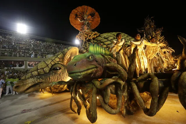 Performers from the Unidos de Vila Isabel samba school parade during Carnival celebrations at the Sambadrome in Rio de Janeiro, Tuesday, February 12, 2013. Rio de Janeiro's samba schools vied for the title of the year's best in an over-the-top, all-night-long Carnival parade at the city's iconic Sambadrome. (Photo by Silvia Izquierdo/AP Photo)