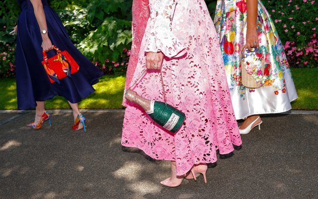 A woman carries a champagne handbag at the 2025 Royal Ascot horseracing festival in England on June 19, 2025. (Photo by Tom Jenkins/The Guardian)
