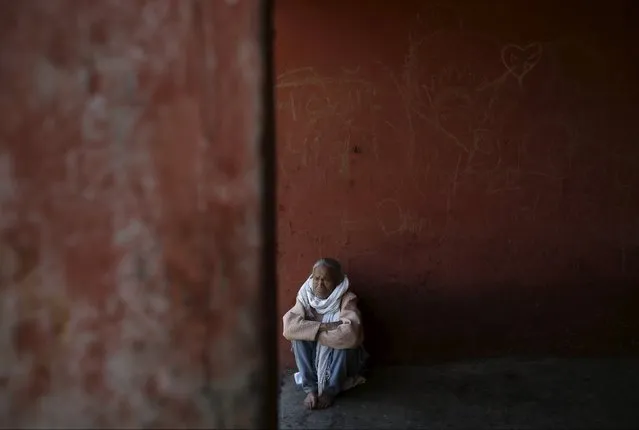 A medium sits inside the temple as he waits for his friends to perform rituals during the Shikali festival at Khokana village in Lalitpur, Nepal October 19, 2015. (Photo by Navesh Chitrakar/Reuters)