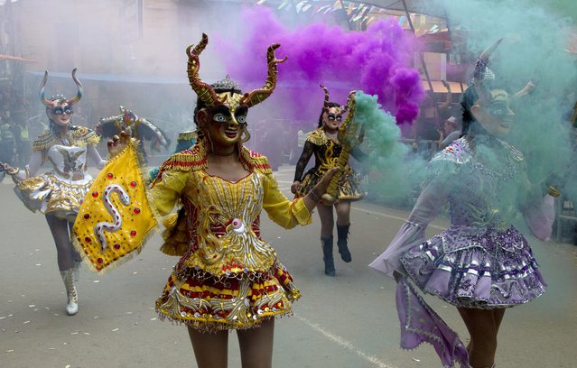 Dancers perform the traditional “Diablada” or Dance of the Devils during the Carnival in Oruro, Bolivia, Saturday, February 10, 2018. (Photo by Juan Karita/AP Photo)