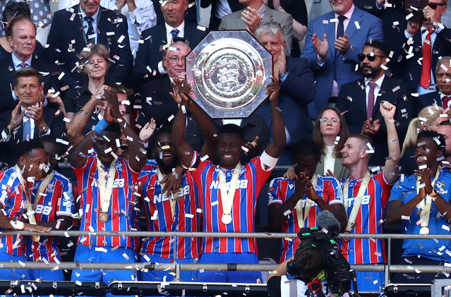 Marc Guehi of Crystal Palace lifts the Community Shield after his side's victory in a penalty shootout during the 2025 FA Community Shield match between Crystal Palace and Liverpool at Wembley Stadium on August 10, 2025 in London, England. (Photo by Toby Melville/Reuters)