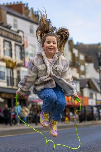 Billie Louth, five, joined the annual Shrove Tuesday Skipping Day on Foreshore Road in Scarborough, UK which was closed for the occasion on February 21, 2023. (Photo by James Glossop/The Times)