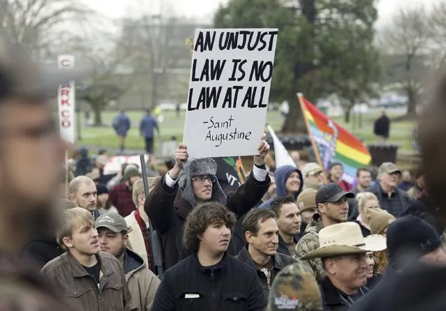 Gun rights advocates rally against Initiative 594 at the state capitol in Olympia, Washington December 13, 2014. (Photo by Jason Redmond/Reuters)