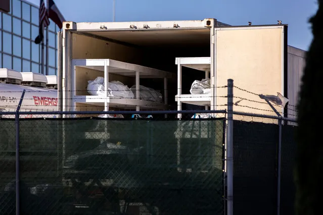 Bodies lie inside a refrigerated trailer, one of several being used to accomodate a surge in coronavirus disease (COVID-19) deaths, outside the Medical Examiner's Office in El Paso, Texas, U.S. November 14, 2020. (Photo by Ivan Pierre Aguirre/Reuters)